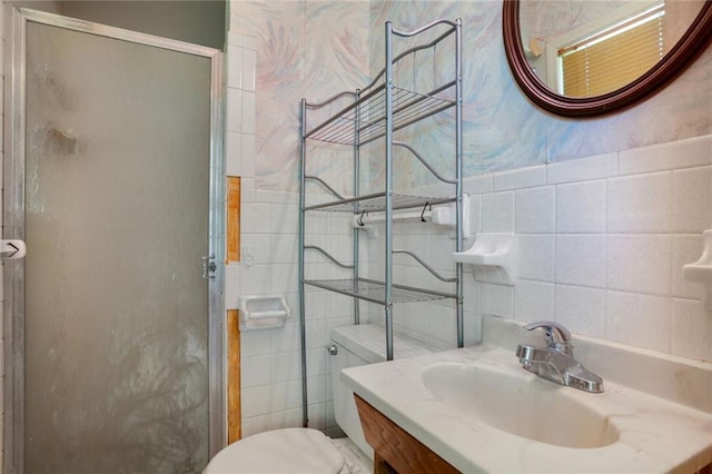 619 E 109th Ter, Kansas City, MO 64131 - bathroom featuring tile walls, a stall shower, and vanity