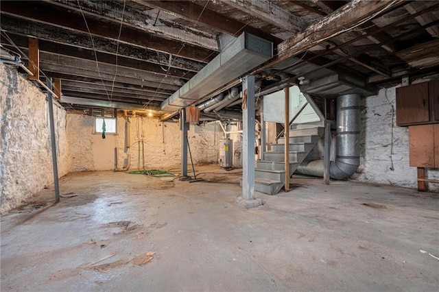 3344 Chestnut Ave, Kansas City, MO 64128 - basement featuring gas water heater and stairs