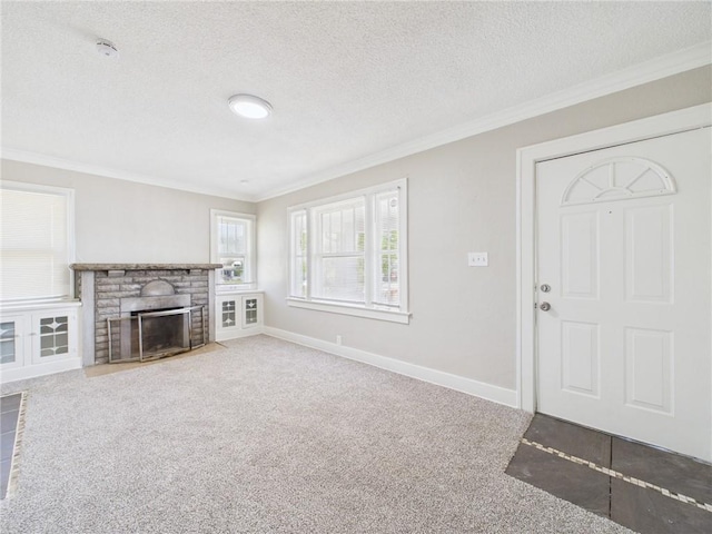 3904 Bales Ave, Kansas City, MO 64130 - unfurnished living room with crown molding, carpet, a textured ceiling, and a brick fireplace