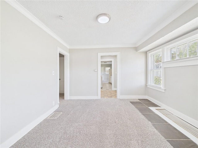 3904 Bales Ave, Kansas City, MO 64130 - carpeted empty room featuring a textured ceiling, crown molding, and a smoke detector