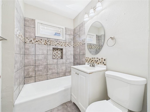 3904 Bales Ave, Kansas City, MO 64130 - bathroom featuring vanity, shower / tub combination, and tile patterned flooring