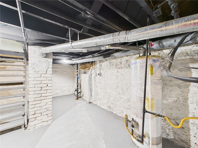 3904 Bales Ave, Kansas City, MO 64130 - unfinished basement with water heater