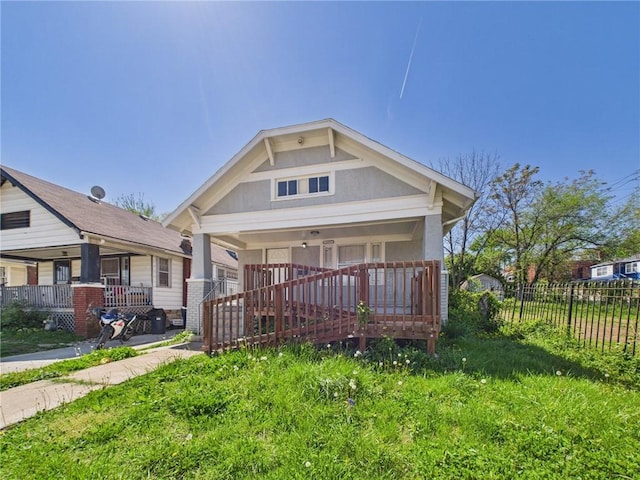 3904 Bales Ave, Kansas City, MO 64130 - view of front of home with covered porch and stucco siding