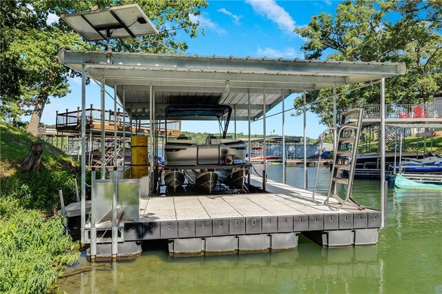 48 M St, Lake Lotawana, MO 64086 - dock area featuring a water view and boat lift