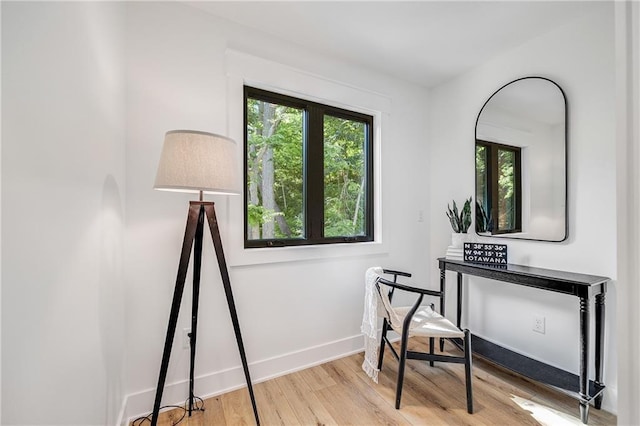 48 M St, Lake Lotawana, MO 64086 - sitting room with wood finished floors and baseboards
