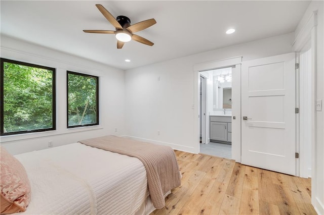 48 M St, Lake Lotawana, MO 64086 - bedroom with light wood-type flooring, recessed lighting, ensuite bath, and ceiling fan