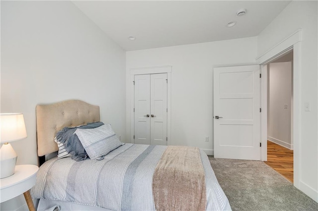 48 M St, Lake Lotawana, MO 64086 - carpeted bedroom featuring a closet and baseboards