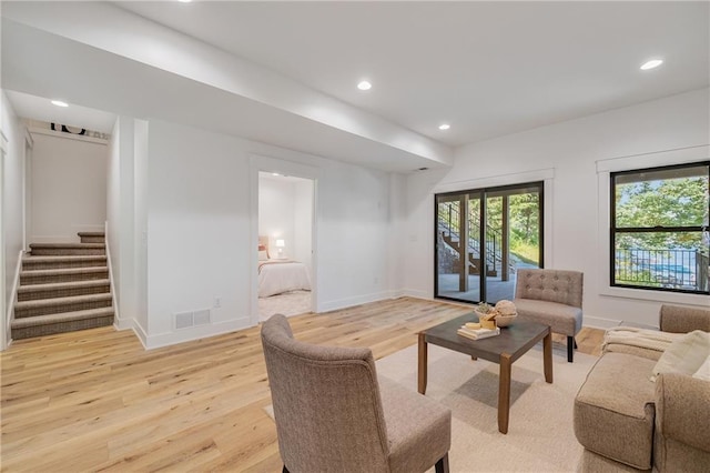 48 M St, Lake Lotawana, MO 64086 - living area featuring light wood-type flooring, stairway, and recessed lighting