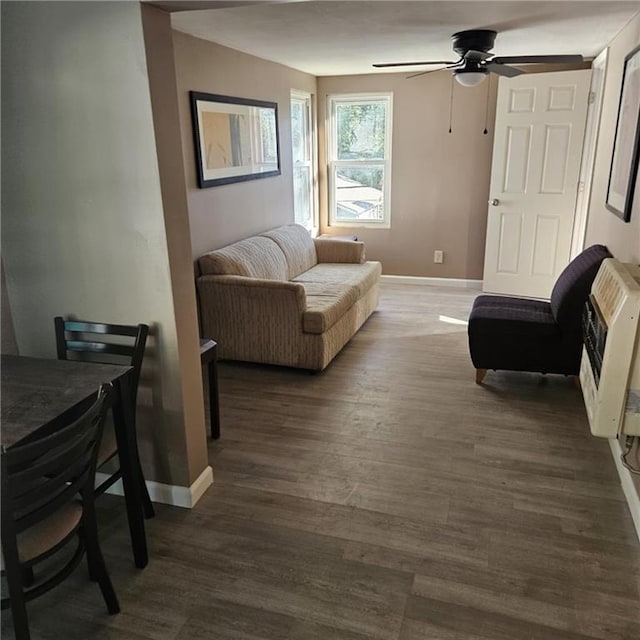 11601 E US Highway 24th Rd, Independence, MO 64054 - living area with heating unit, a ceiling fan, and wood finished floors
