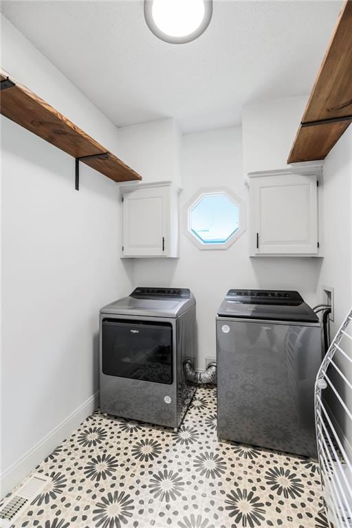 11245 S Penrose St, Olathe, KS 66061 - laundry room featuring washer and dryer and cabinet space