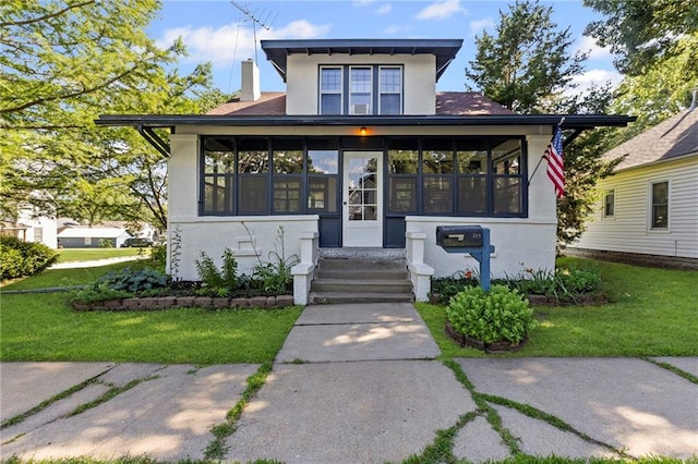 309 E Miami St, Paola, KS 66071 - view of front facade featuring stucco siding, entry steps, a chimney, and a front lawn