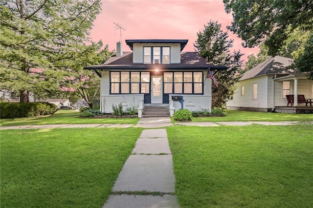 309 E Miami St, Paola, KS 66071 - view of front facade with a front lawn and stucco siding