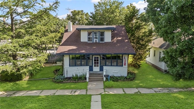 309 E Miami St, Paola, KS 66071 - view of front of property with a chimney, stucco siding, and roof with shingles