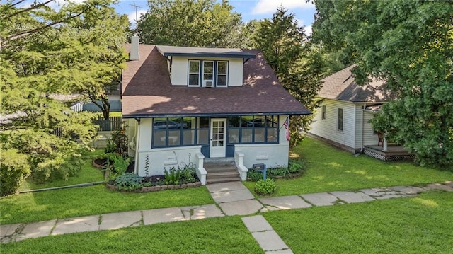309 E Miami St, Paola, KS 66071 - view of front of home featuring a front lawn, stucco siding, a shingled roof, a chimney, and a wooden deck