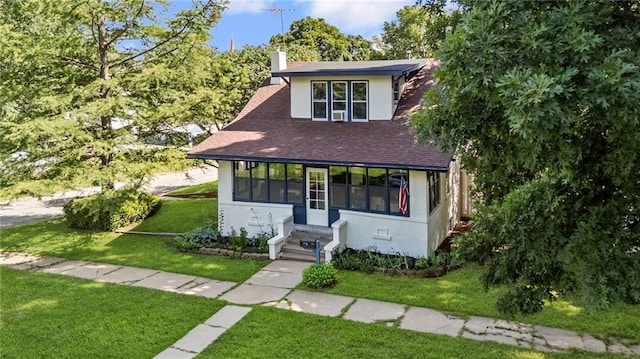 309 E Miami St, Paola, KS 66071 - view of front facade featuring a chimney, a front yard, stucco siding, and a shingled roof