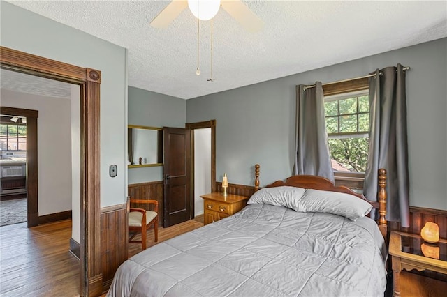 309 E Miami St, Paola, KS 66071 - bedroom with a textured ceiling, wood finished floors, and a ceiling fan