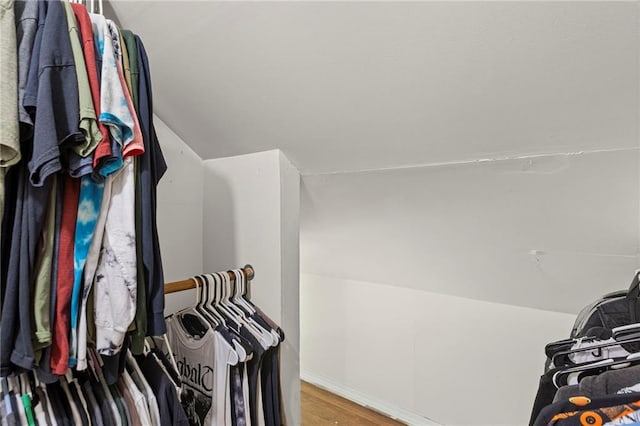 309 E Miami St, Paola, KS 66071 - walk in closet featuring wood finished floors and vaulted ceiling