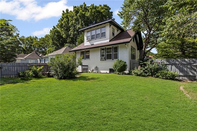 309 E Miami St, Paola, KS 66071 - back of property with stucco siding, a fenced backyard, and a shingled roof