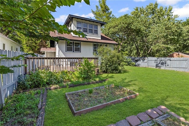 309 E Miami St, Paola, KS 66071 - fenced backyard with a vegetable garden