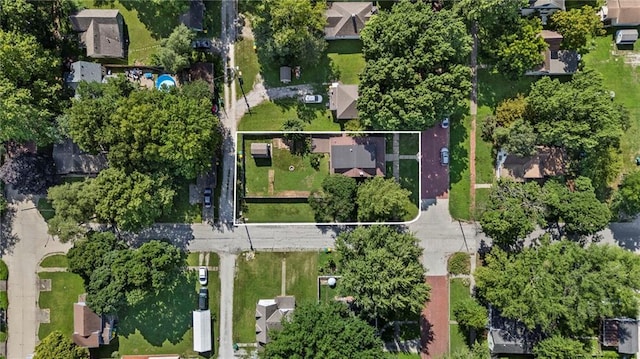 309 E Miami St, Paola, KS 66071 - aerial view of property and surrounding area with property boundaries highlighted and nearby suburban area