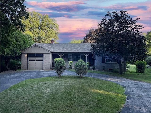 8614 Meadow Ln, Leawood, KS 66206 - single story home with curved driveway, a yard, a garage, and a chimney