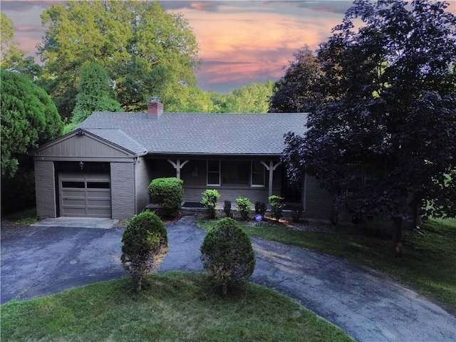 8614 Meadow Ln, Leawood, KS 66206 - ranch-style house featuring asphalt driveway, an attached garage, a chimney, brick siding, and roof with shingles