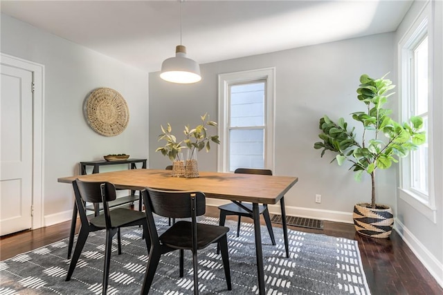 521 Tracy Ave, Kansas City, MO 64016 - dining room with dark wood finished floors and baseboards