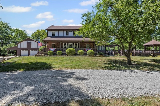 1124 S Locust St, Ottawa, KS 66067 - view of front of property featuring an outdoor structure, a gazebo, a porch, and a front lawn