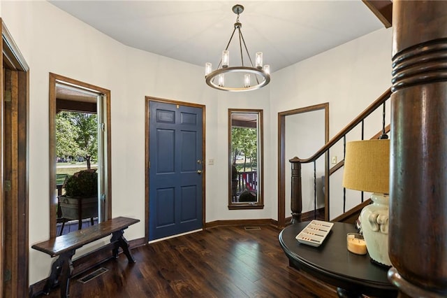 1124 S Locust St, Ottawa, KS 66067 - entrance foyer with wood finished floors, a chandelier, and stairs