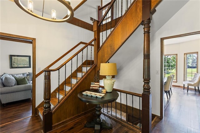1124 S Locust St, Ottawa, KS 66067 - stairs with wood finished floors and a towering ceiling