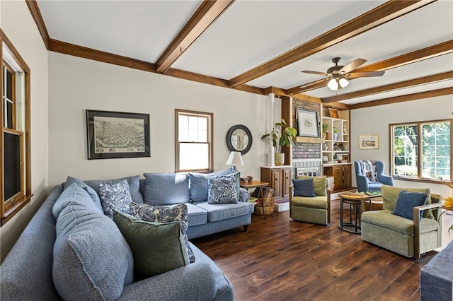 1124 S Locust St, Ottawa, KS 66067 - living room featuring dark wood finished floors, beamed ceiling, and a ceiling fan