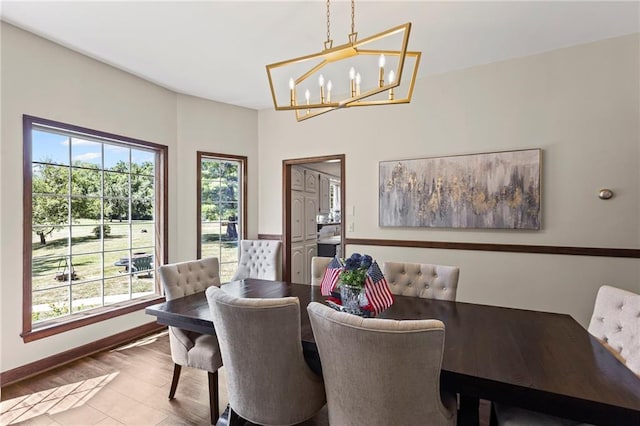 1124 S Locust St, Ottawa, KS 66067 - dining area featuring a chandelier