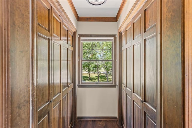 1124 S Locust St, Ottawa, KS 66067 - doorway to outside with crown molding and dark wood finished floors