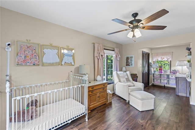 1124 S Locust St, Ottawa, KS 66067 - bedroom with dark wood-style floors and a ceiling fan
