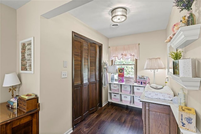 1124 S Locust St, Ottawa, KS 66067 - entrance foyer featuring dark wood-type flooring and baseboards