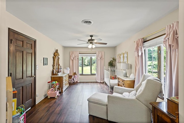 1124 S Locust St, Ottawa, KS 66067 - living room featuring dark wood finished floors and ceiling fan