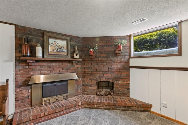 1124 S Locust St, Ottawa, KS 66067 - unfurnished living room with a fireplace, a textured ceiling, and carpet floors