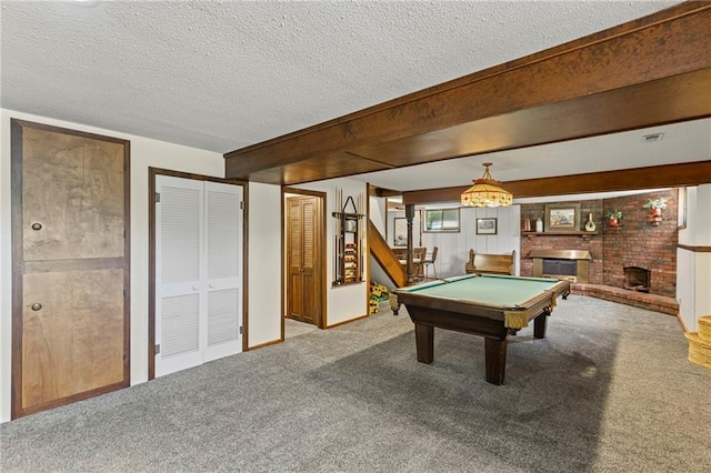 1124 S Locust St, Ottawa, KS 66067 - game room with carpet, a textured ceiling, a brick fireplace, and billiards