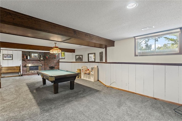 1124 S Locust St, Ottawa, KS 66067 - rec room with carpet flooring, healthy amount of natural light, pool table, a textured ceiling, and a wainscoted wall