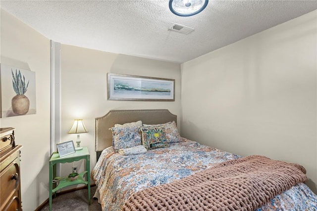 1124 S Locust St, Ottawa, KS 66067 - carpeted bedroom with a textured ceiling