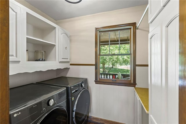1124 S Locust St, Ottawa, KS 66067 - laundry area featuring washer and clothes dryer and cabinet space