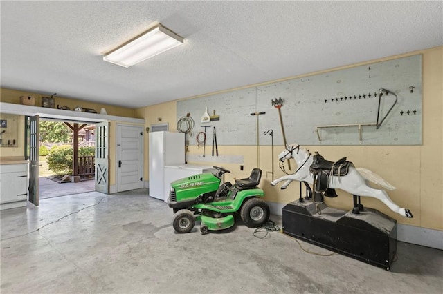 1124 S Locust St, Ottawa, KS 66067 - garage featuring freestanding refrigerator