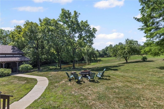 1124 S Locust St, Ottawa, KS 66067 - view of green lawn with a fire pit