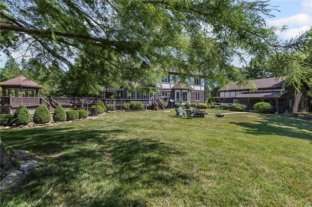1124 S Locust St, Ottawa, KS 66067 - view of grassy yard featuring a gazebo and a fire pit