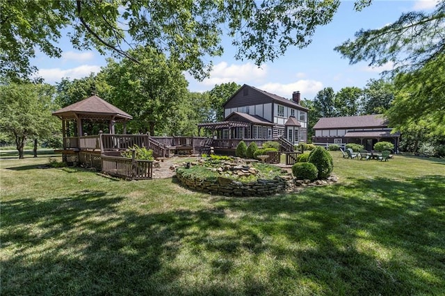 1124 S Locust St, Ottawa, KS 66067 - view of grassy yard with a gazebo and a wooden deck