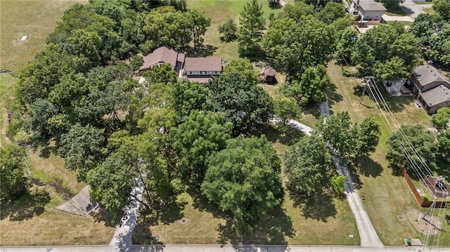 1124 S Locust St, Ottawa, KS 66067 - aerial view of property and surrounding area featuring a tree filled landscape