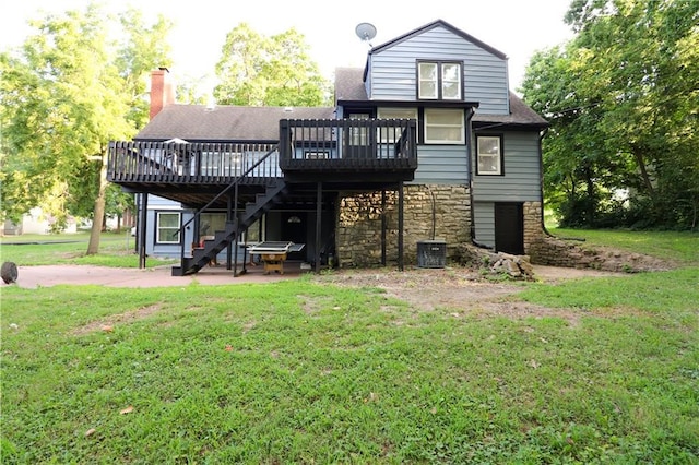 818 W 30th St, Independence, MO 64055 - rear view of property with a deck, stairs, a patio, a lawn, and stone siding