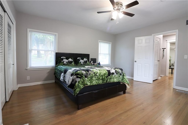 818 W 30th St, Independence, MO 64055 - bedroom with wood finished floors and ceiling fan