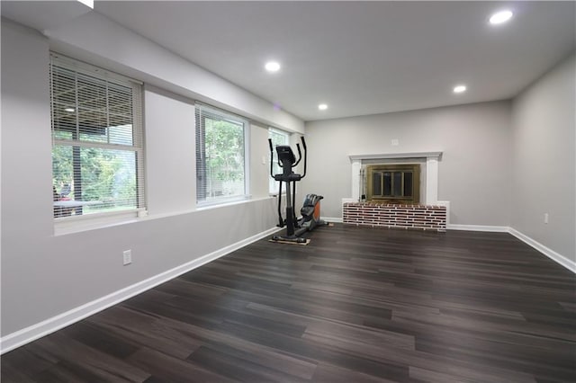 818 W 30th St, Independence, MO 64055 - workout room featuring wood finished floors, recessed lighting, and a fireplace