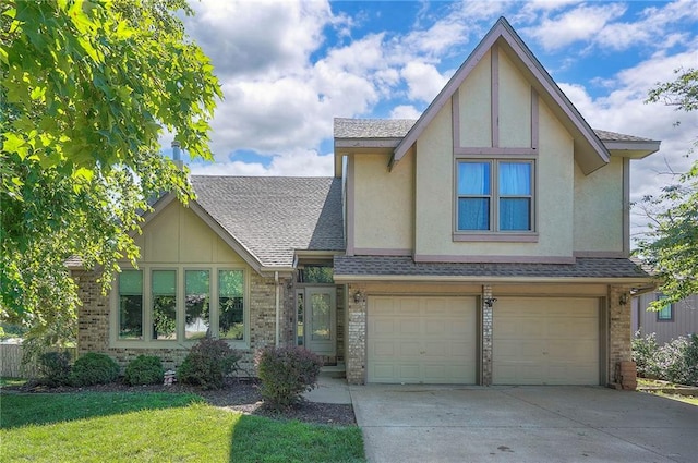 3945 N 123rd Ter, Kansas City, KS 66109 - tudor-style house with driveway, stucco siding, a garage, and brick siding